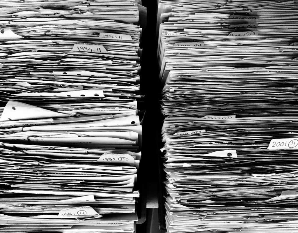 black and white overhead shot of paper files